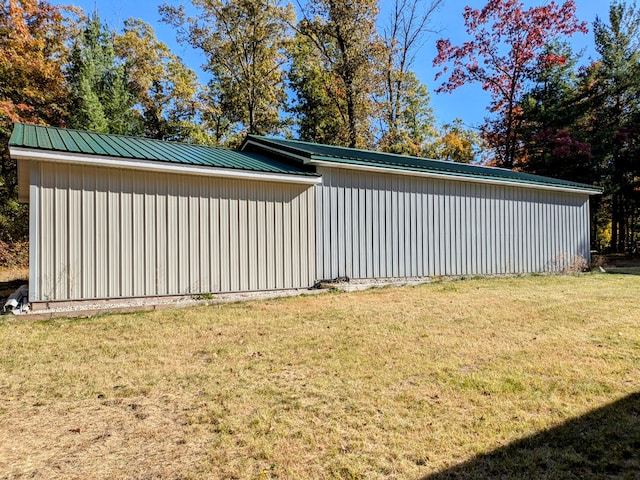 view of home's exterior with a lawn