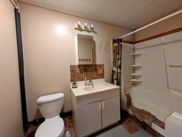 full bathroom featuring vanity, shower / tub combo, and toilet