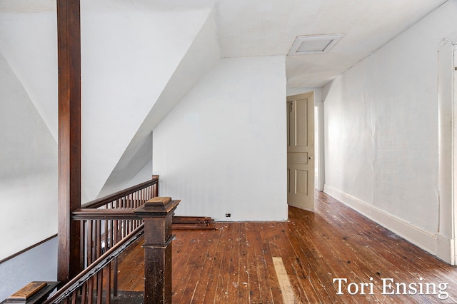 staircase with hardwood / wood-style floors