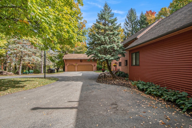 view of side of home with a garage