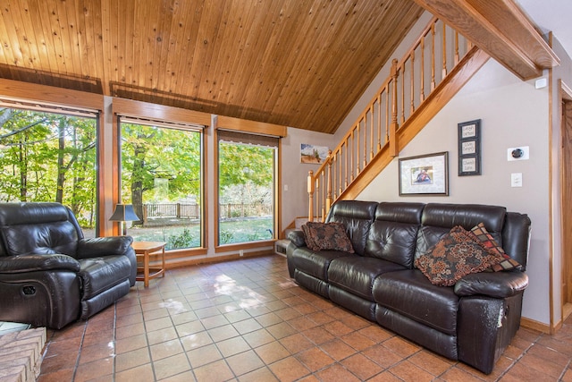 tiled living room featuring wooden ceiling, vaulted ceiling, and plenty of natural light