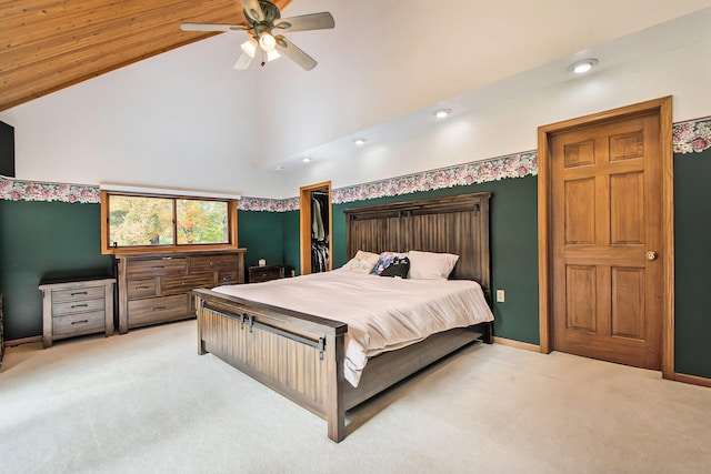 bedroom featuring ceiling fan, high vaulted ceiling, and light colored carpet