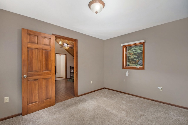 empty room with carpet floors and ceiling fan