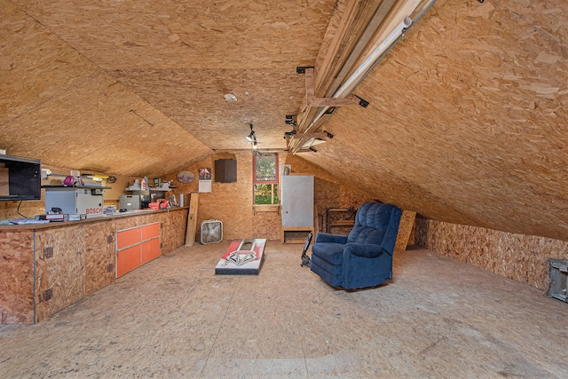 additional living space featuring vaulted ceiling