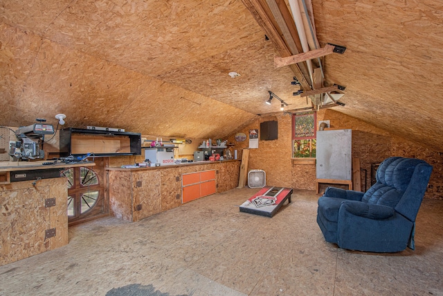 interior space featuring vaulted ceiling and plenty of natural light