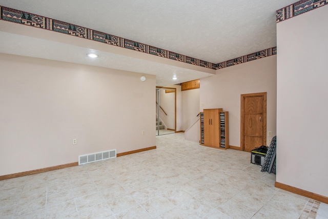 basement with a textured ceiling