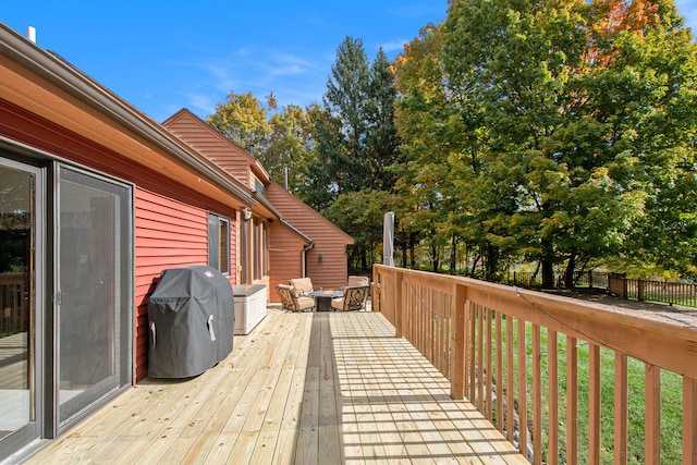 wooden deck featuring grilling area