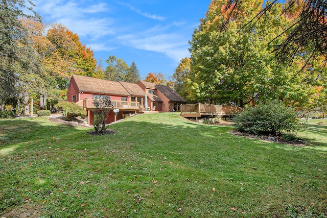 view of yard featuring a wooden deck