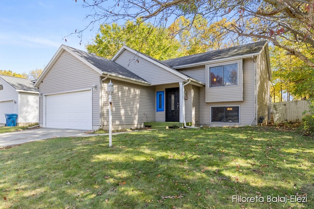 view of front facade with a front yard and a garage