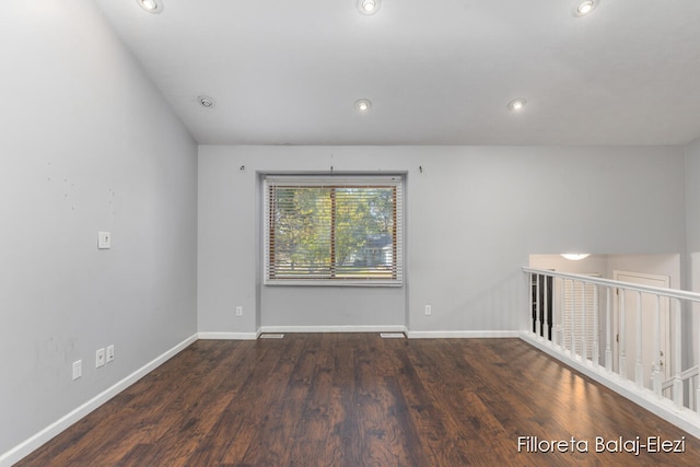 unfurnished room featuring dark hardwood / wood-style floors