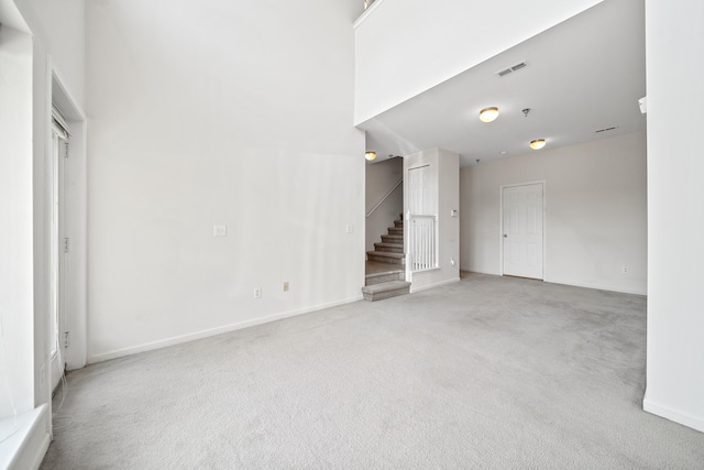 unfurnished living room with carpet