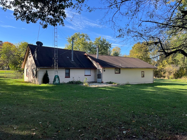 back of house with a yard