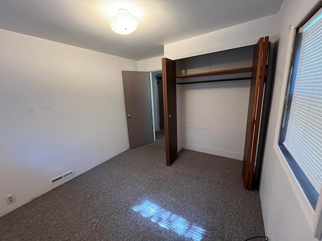 unfurnished bedroom featuring a closet