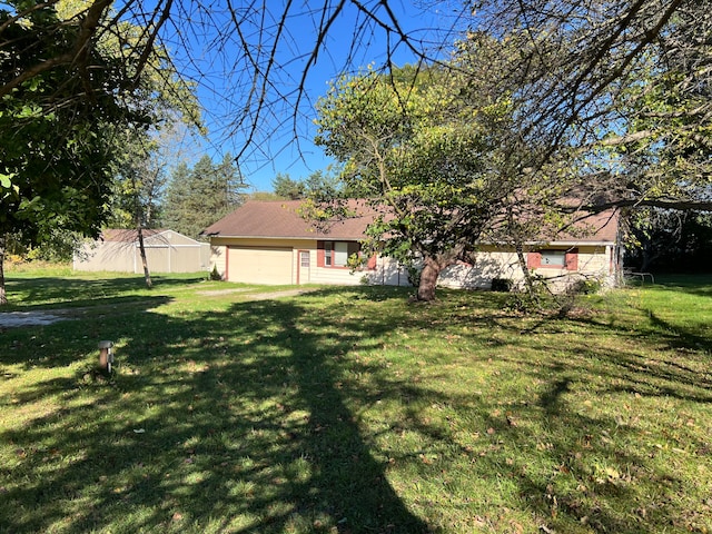 view of yard featuring a garage