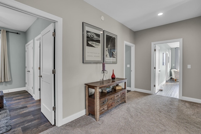 hallway with dark hardwood / wood-style floors