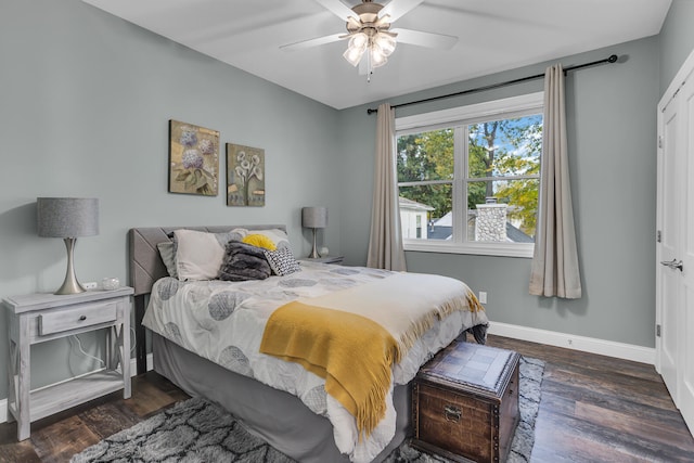 bedroom with ceiling fan and dark hardwood / wood-style flooring