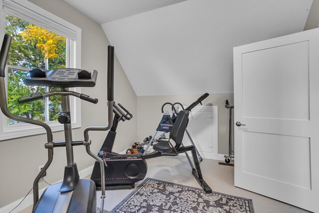 exercise area featuring vaulted ceiling