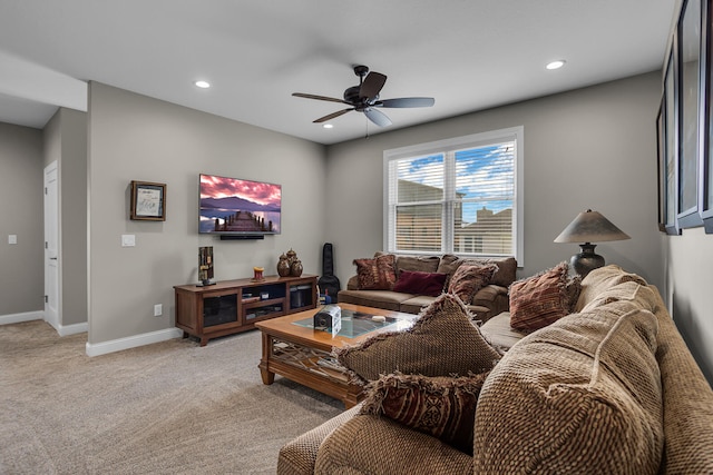 carpeted living room with ceiling fan