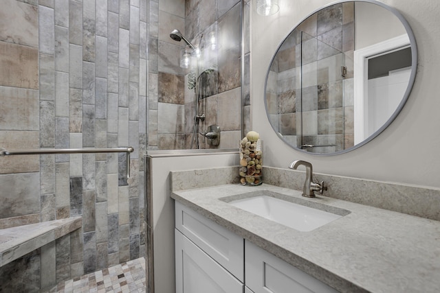 bathroom with vanity and a shower with shower door