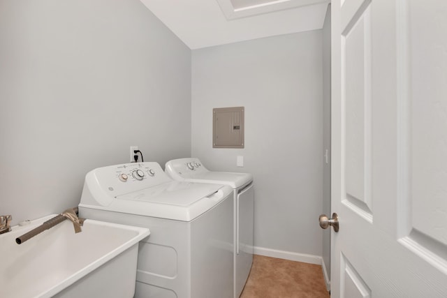 washroom with electric panel, sink, and washing machine and clothes dryer