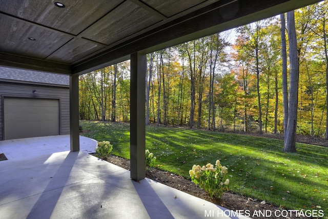 view of patio featuring a garage