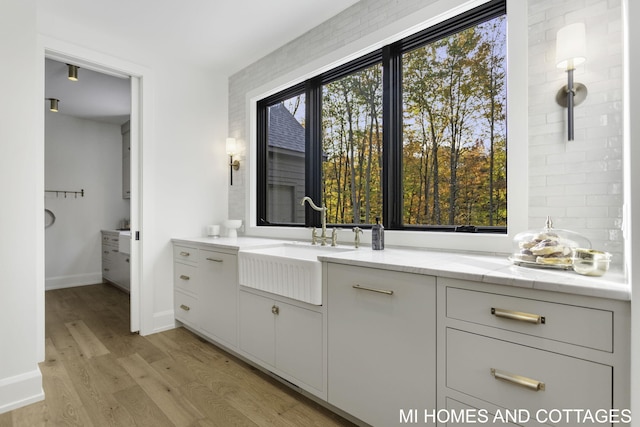 bathroom with vanity, hardwood / wood-style floors, and plenty of natural light