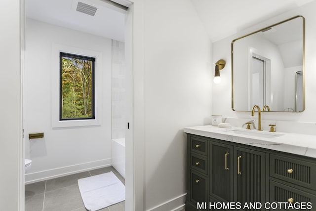 full bathroom with lofted ceiling, toilet, tile patterned flooring, vanity, and shower with separate bathtub