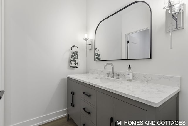 bathroom with vanity and hardwood / wood-style flooring