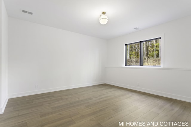 empty room featuring hardwood / wood-style flooring