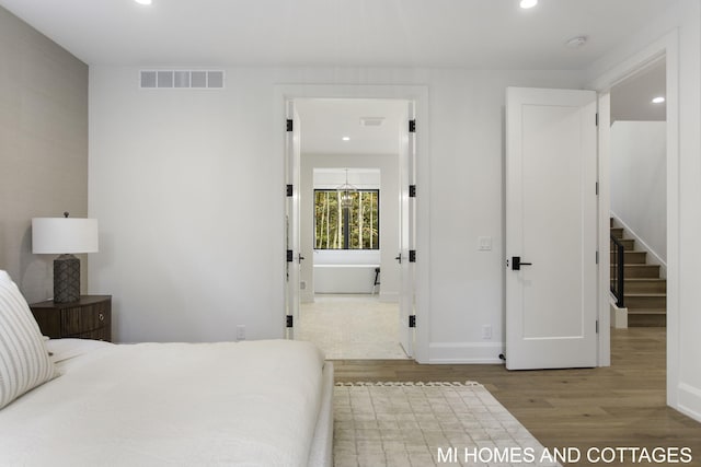 bedroom with light wood-type flooring