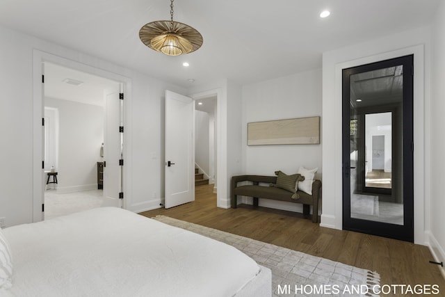 bedroom with hardwood / wood-style flooring