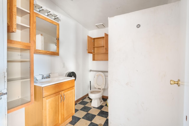 bathroom with toilet and vanity