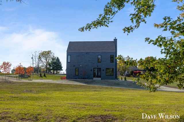 back of house with a yard