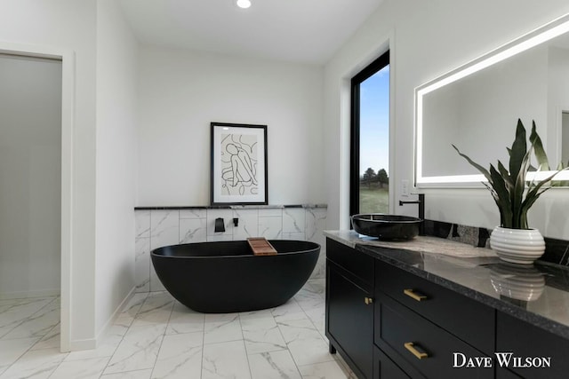 bathroom featuring a bathing tub and vanity