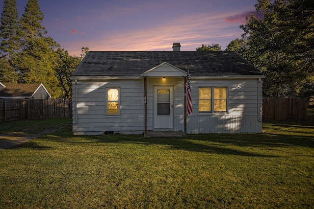 view of front of home with a yard