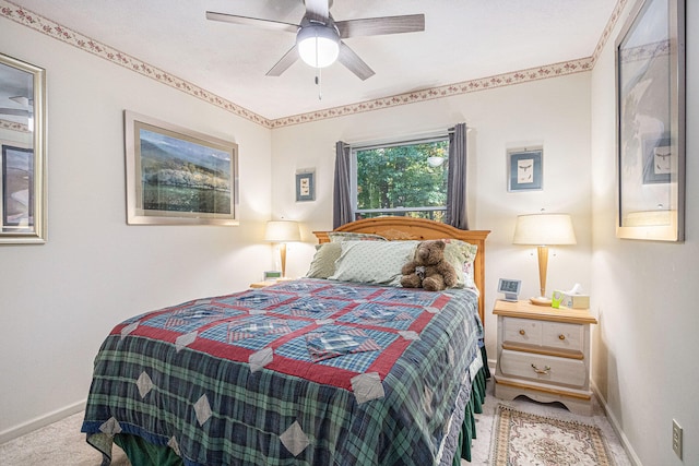 bedroom with light colored carpet and ceiling fan