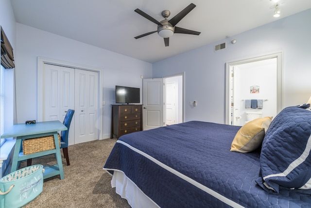 carpeted bedroom featuring a closet and ceiling fan