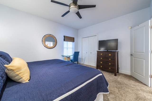 bedroom featuring a closet, ceiling fan, and light carpet