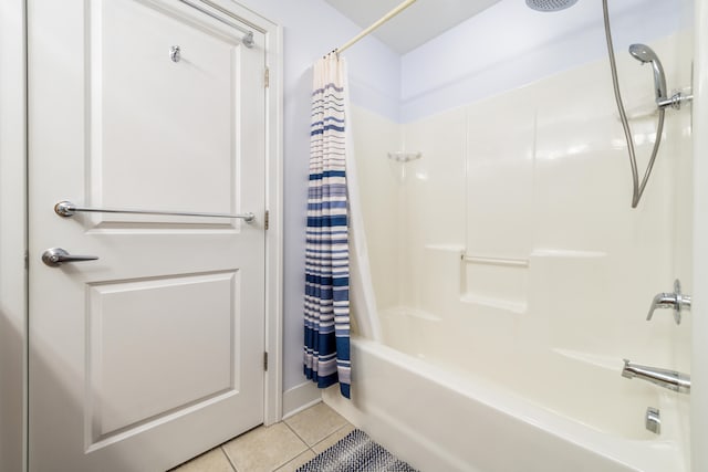 bathroom with shower / tub combo and tile patterned flooring