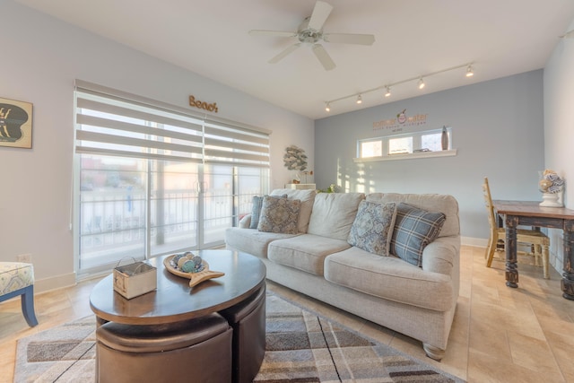 living room with light tile patterned flooring and ceiling fan