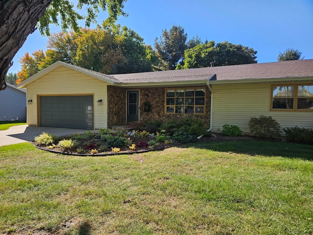 single story home with a garage and a front yard