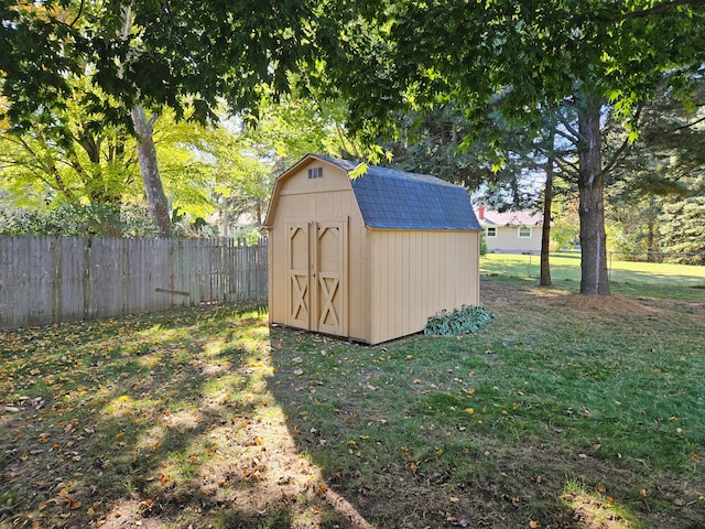 view of outdoor structure featuring a lawn