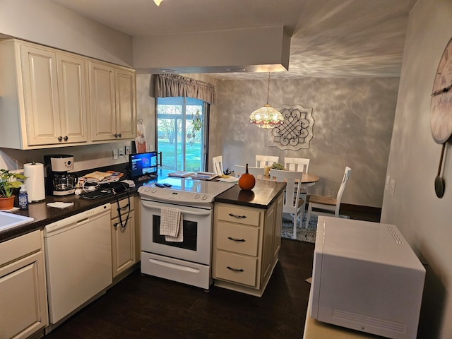 kitchen featuring sink, kitchen peninsula, white appliances, dark wood-type flooring, and pendant lighting