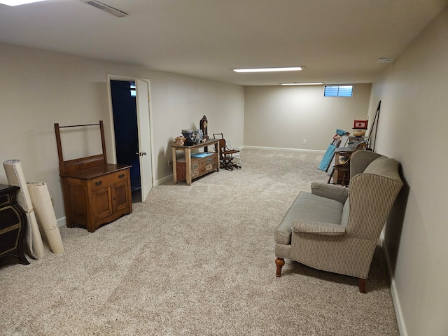 sitting room with light colored carpet