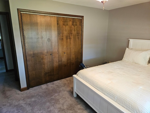 carpeted bedroom with a closet