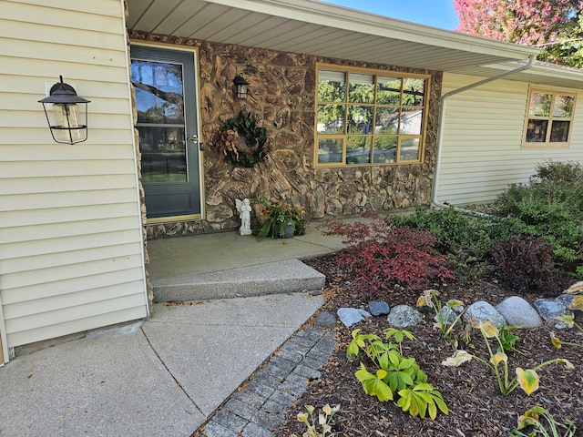 entrance to property featuring a patio