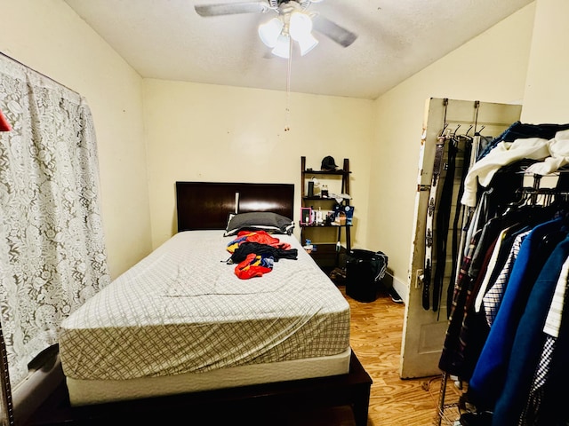 bedroom featuring hardwood / wood-style floors and ceiling fan