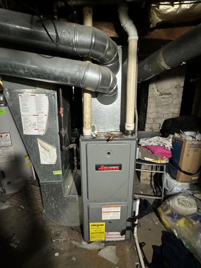 utility room featuring gas water heater