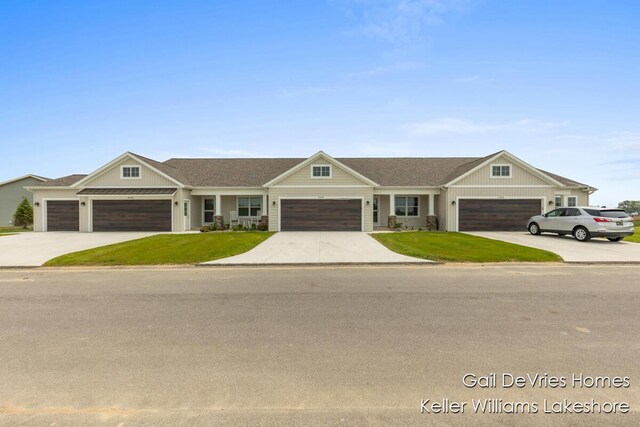 4494 Meadow Pond Way Unit 68, Hamilton, MI 49419 - view of front of property with an attached garage, concrete driveway, a front yard, roof with shingles, and board and batten siding