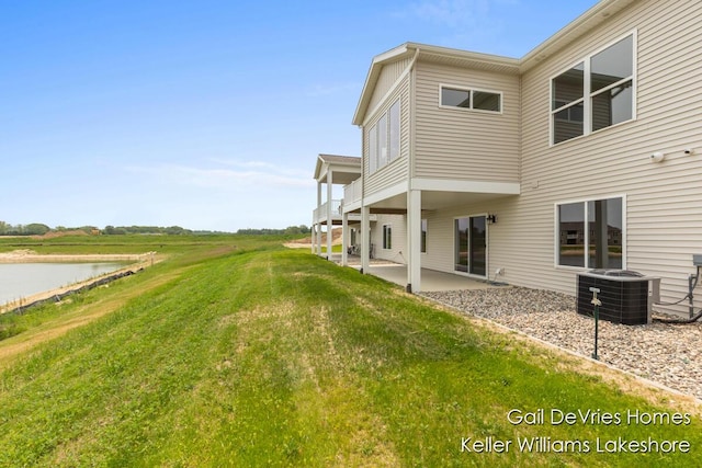 4494 Meadow Pond Way Unit 68, Hamilton, MI 49419 - view of yard with a patio area, cooling unit, and a water view